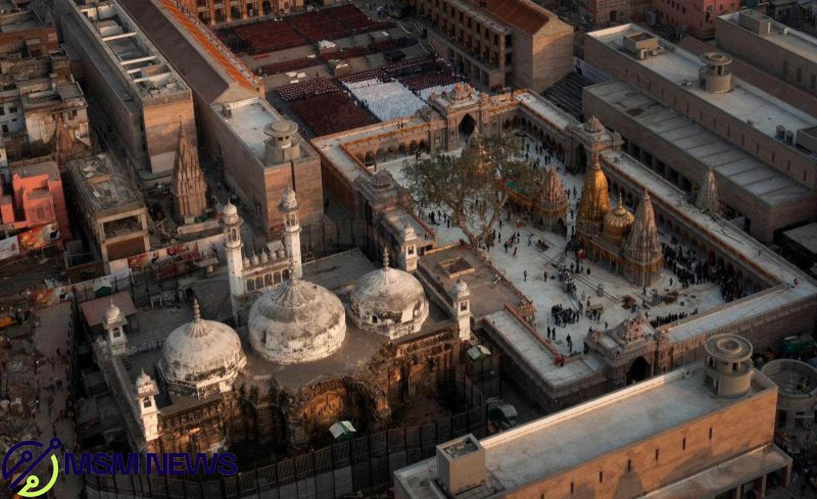 The Gyanvapi mosque, left, and Kashiviswanath Temple on the banks of the river Ganges in Varanasi, India, December 12, 2021.