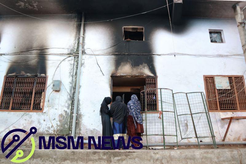 Muslims look inside a charred mosque after it was set on fire by a mob during riots in the Mustafabad area of New Delhi on February 29, 2020.