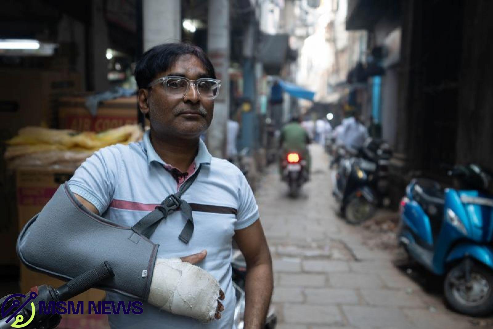 Shamsher Ali worries for his young daughters, who he says are growing up in an increasingly polarized India. His arm was in a cast from a recent traffic accident.